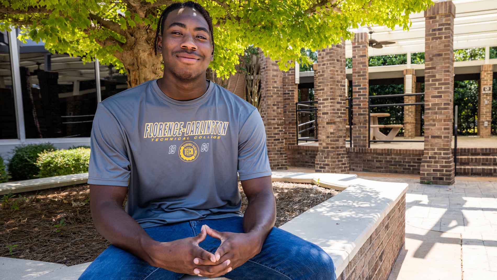 A FDTC Alumni smiles for the camera