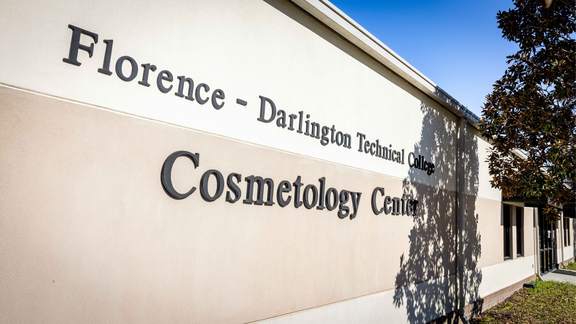 An exterior photograph of the Cosmetology School.