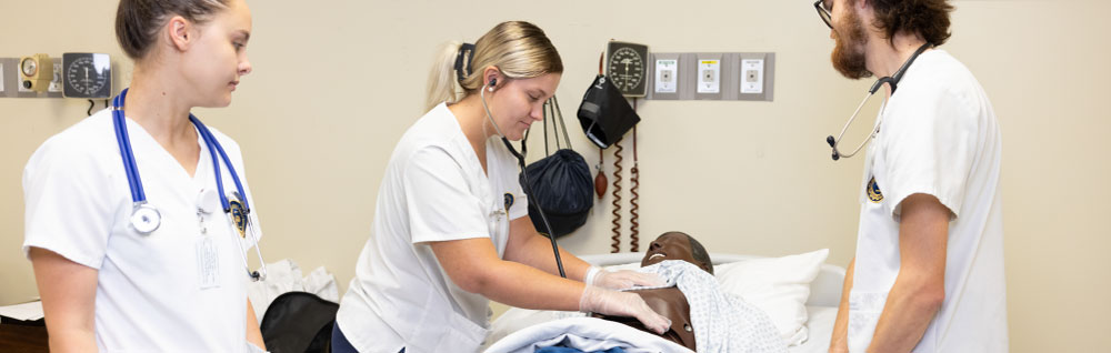 An FDTC practical nursing student practices technique in a hospital classroom