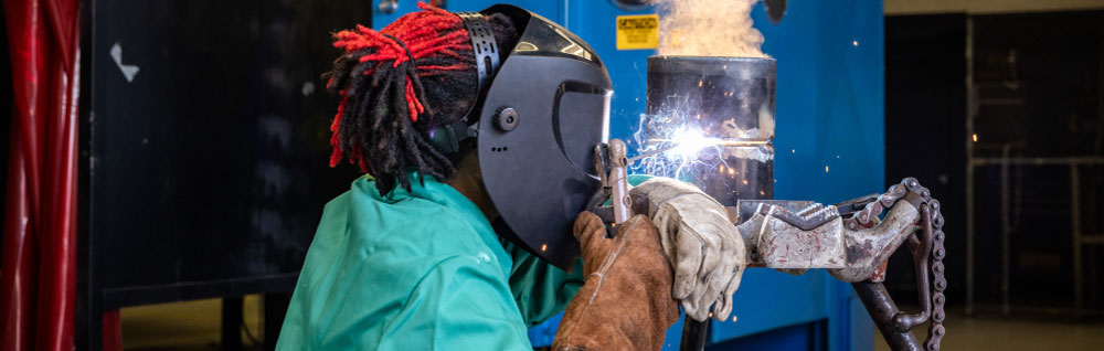 Welding students at FDTC practice welding in the welding lab