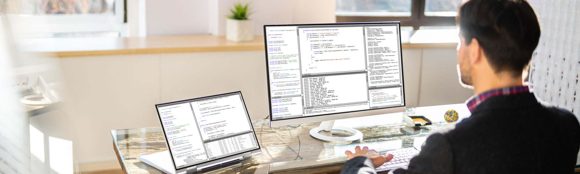 A FDTC Graduate programming a website with HTML code.