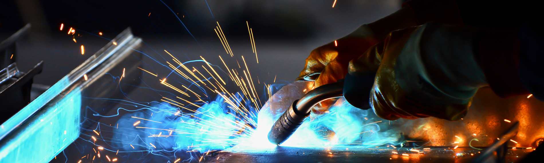 A closeup of a student welding.