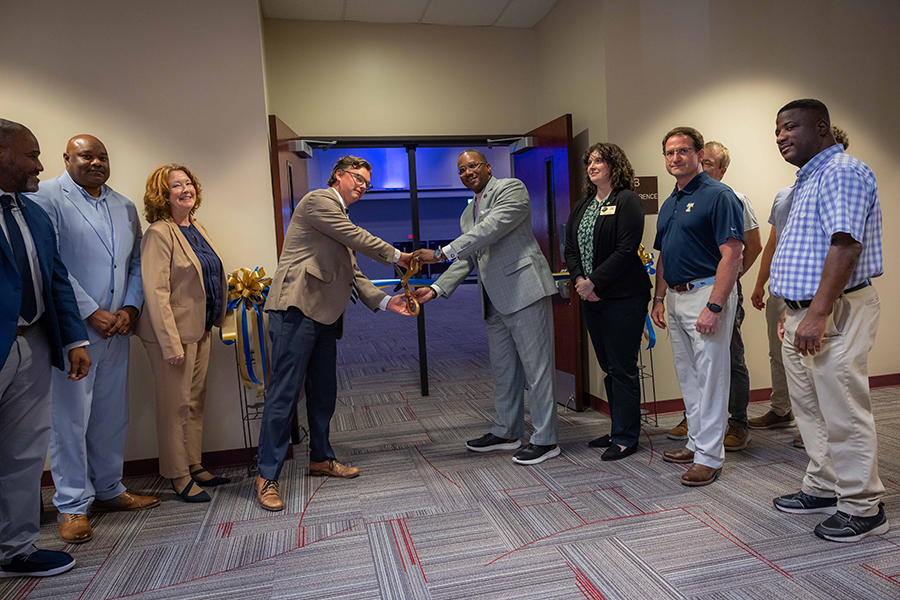 Cutting the ribbon after renovations in the SIMT